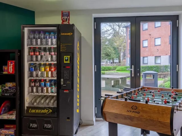 Vending machine and foosball table recreation area at Llys Y Deon in Bangor Student Accommodation