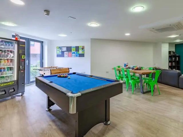 Billiard table foosball table vending machine common room at Llys Y Deon in Bangor Student Accommodation