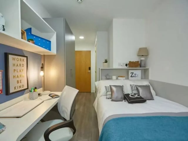 Desk bed and shelves student accommodation bedroom at Collegelands in Glasgow Student Accommodation