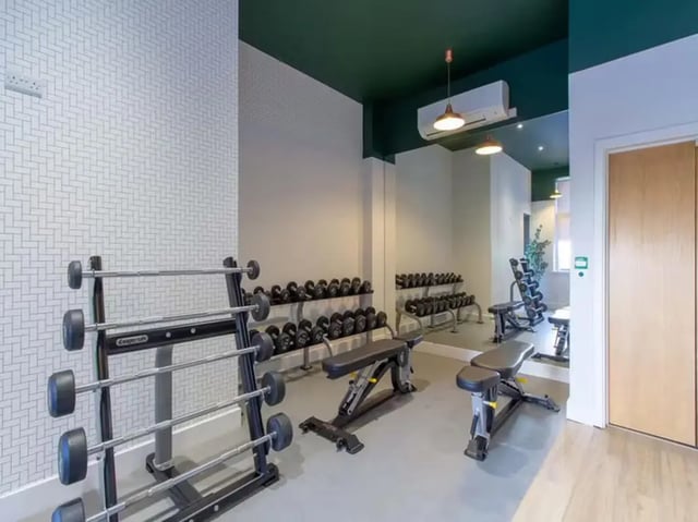 Barbells dumbbells benches weights gym at Collegelands in Glasgow Student Accommodation