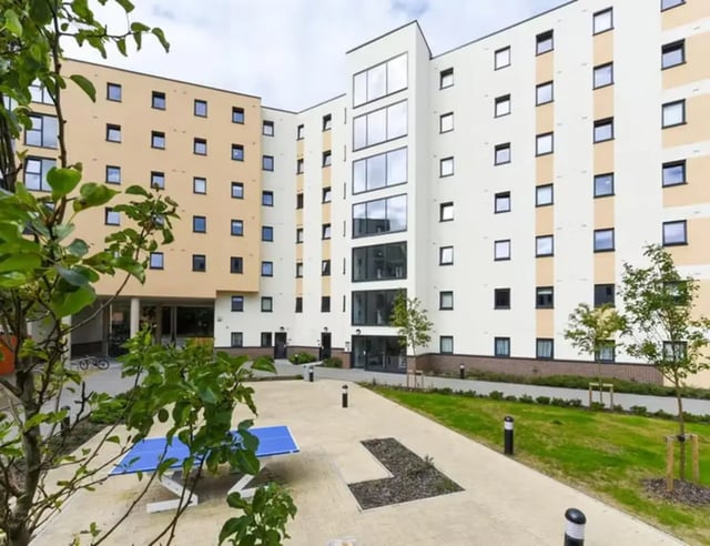 Modern student accommodation building with courtyard playing area at St Davids in Swansea Student Accommodation