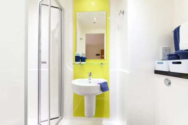 Sink mirror shower and towels bathroom at St Davids in Swansea Student Accommodation