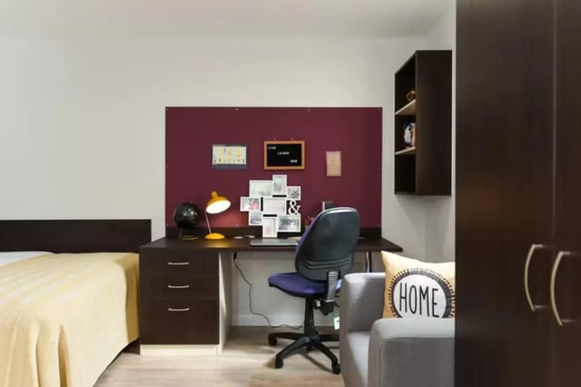 Desk chair lamp globe framed photos study area at St Davids in Swansea Student Accommodation