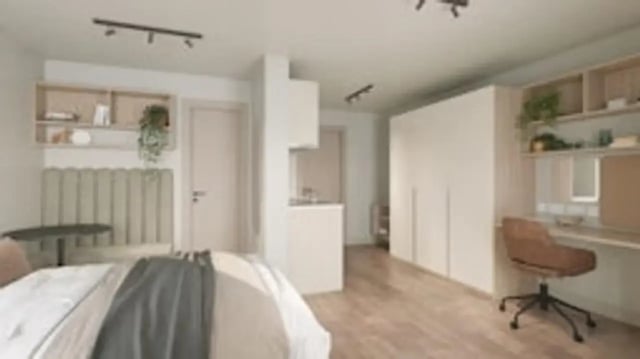 Bed desk wardrobe shelving kitchen area studio apartment at The Boulevard in York Student Accommodation