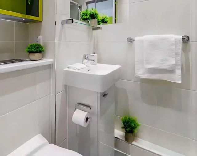 Modern bathroom with sink toilet and towels Bathroom at The Boulevard in York Student Accommodation