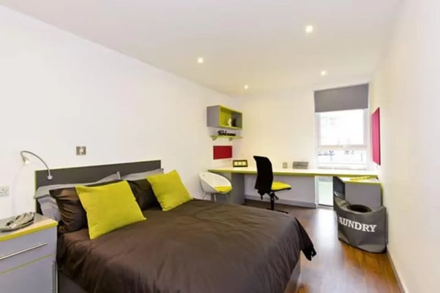Bed desk chair laundry basket bedroom at The Boulevard in York Student Accommodation