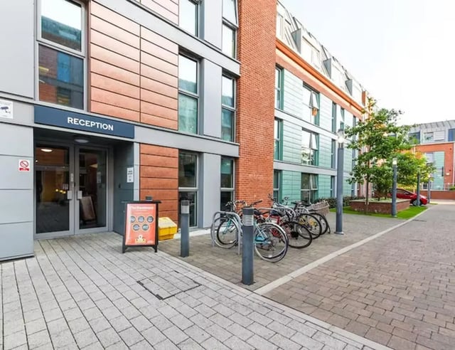 Reception entrance with bicycles and modern building exterior at The Boulevard in York Student Accommodation