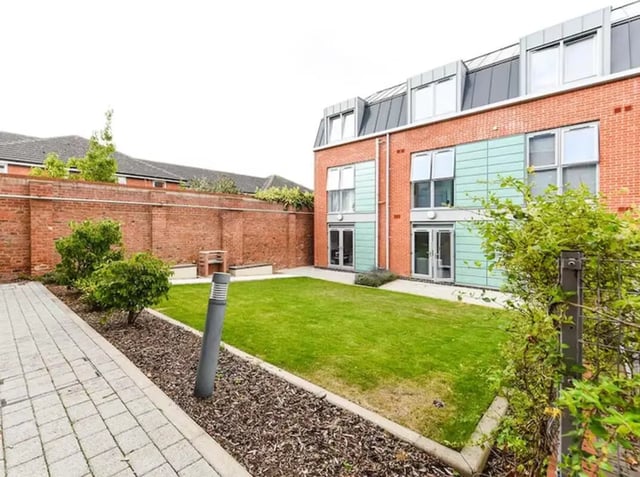 Courtyard with lawn and building exterior at The Boulevard in York Student Accommodation