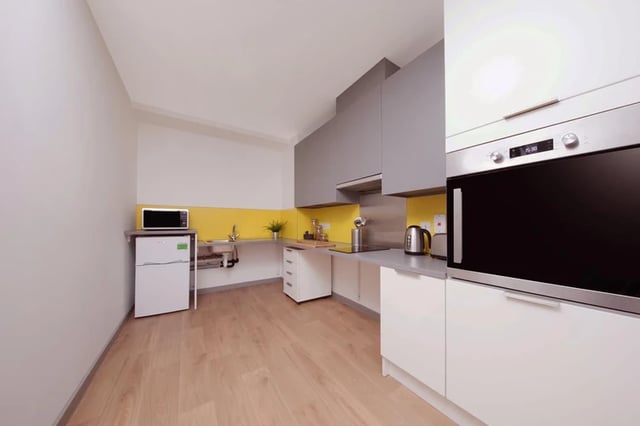 Microwave mini fridge sink kettle oven kitchen at Horizon Heights in Liverpool Student Accommodation