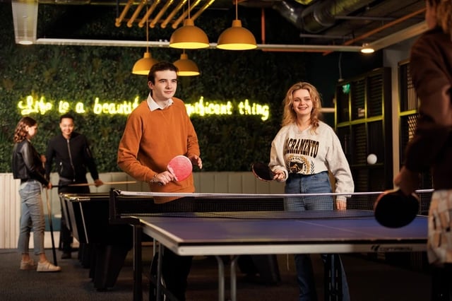 Students playing ping pong at ping pong table area at Horizon Heights in Liverpool Student Accommodation