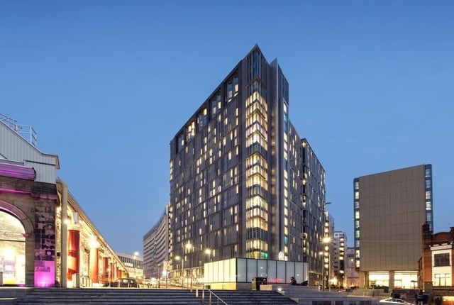 Modern building windows lit at dusk exterior at Horizon Heights in Liverpool Student Accommodation