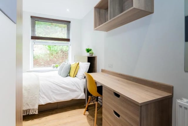 Bed desk and shelf student accommodation bedroom at Bankfield in Huddersfield Student Accommodation