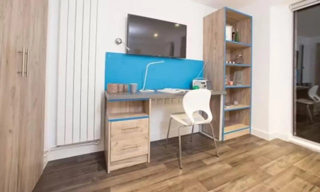 Desk with chair and shelves study area at Edge Apartments in Birmingham Student Accommodation