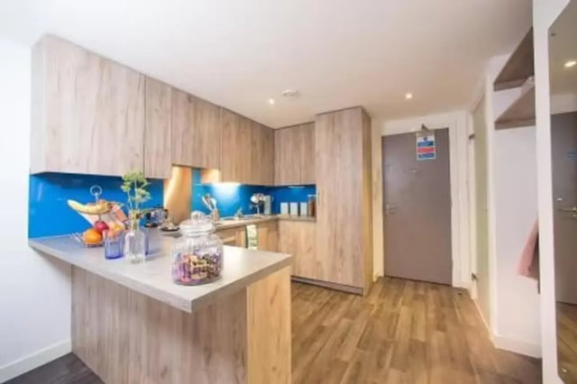 Kitchen with fruit bowl and wooden cabinets kitchen at Edge Apartments in Birmingham Student Accommodation