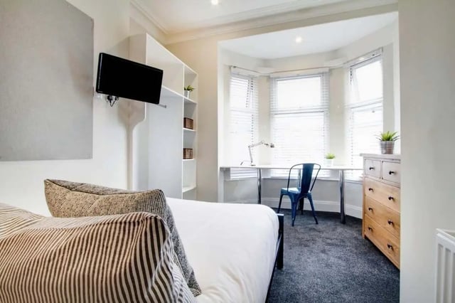 Bed desk chair TV and dresser bedroom at 131 Hyde Park in Leeds Student Accommodation