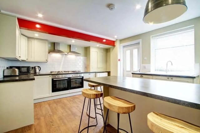 Stools at island counter double oven kitchen kitchen at 131 Hyde Park in Leeds Student Accommodation