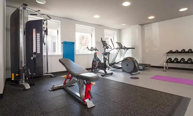 Gym equipment with weight rack and yoga mat gym at Claremont House in Glasgow Student Accommodation