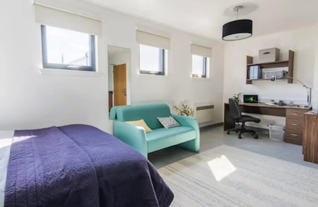 Bed couch desk and chair living room at Claremont House in Glasgow Student Accommodation