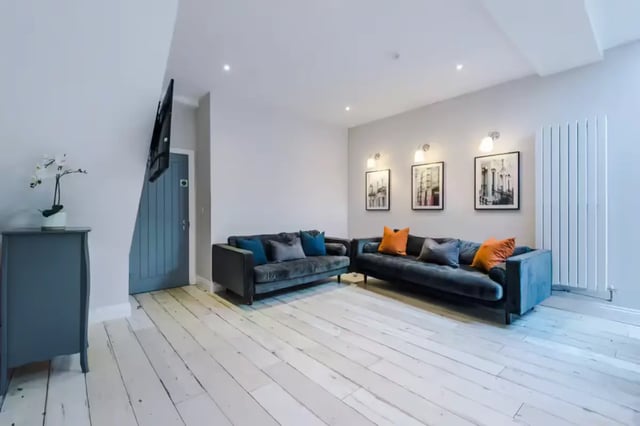 Two sofas artwork radiator living room at 86 Woodcroft Road in Liverpool Student Accommodation