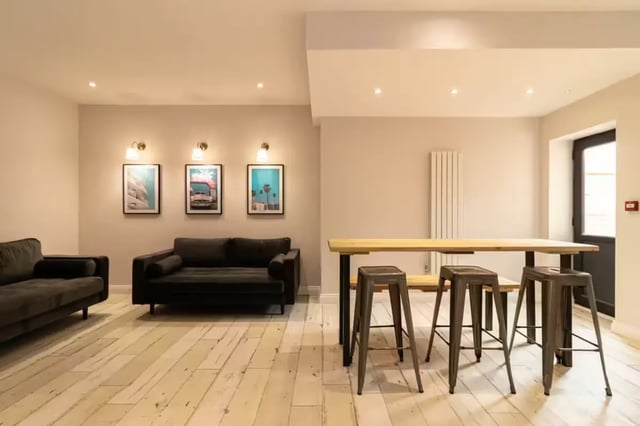 Sofa table stools and art living room at 74 Woodcroft Road in Liverpool Student Accommodation