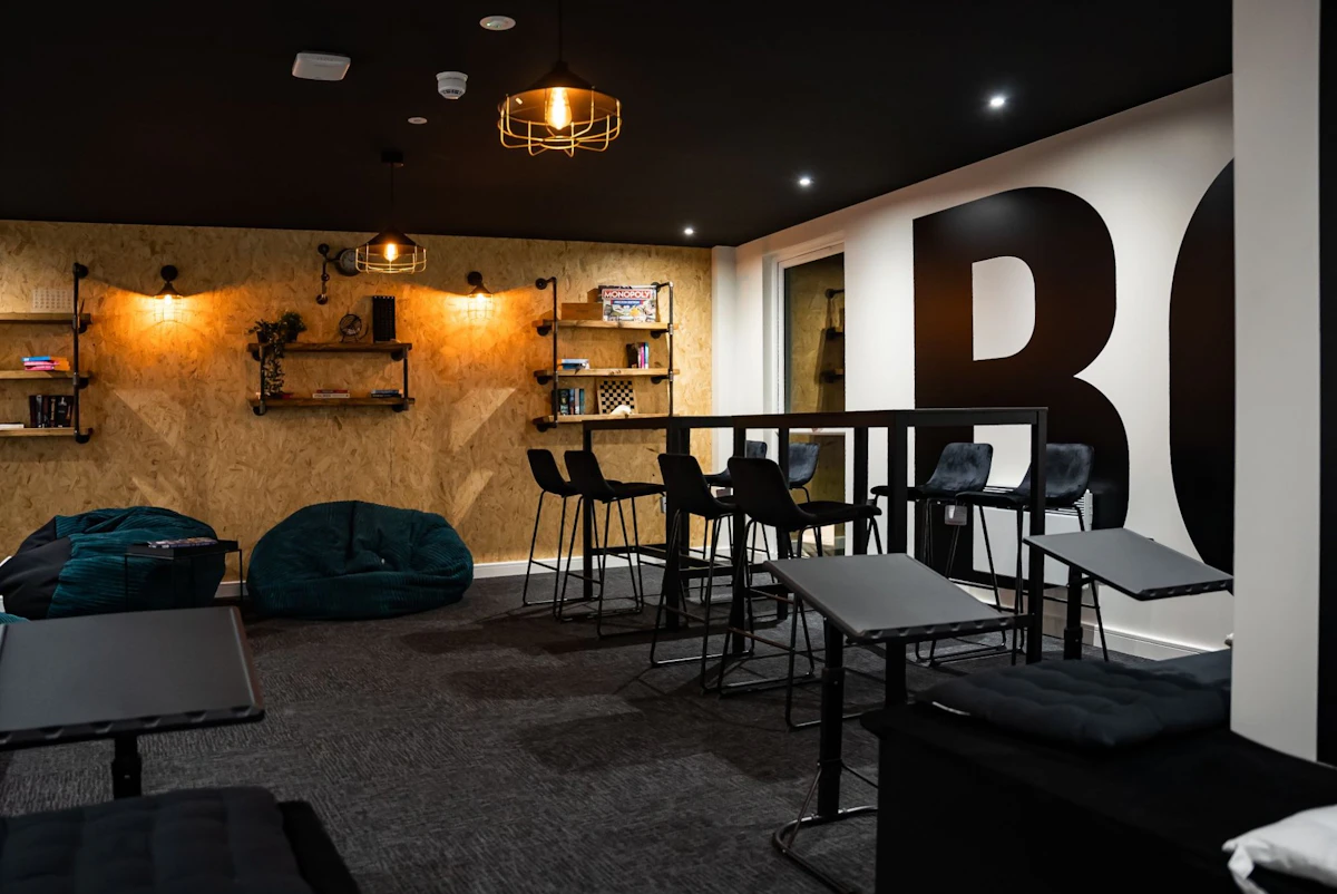 Beanbags bar stools and shelves common area at Urban Hub in Preston Student Accommodation