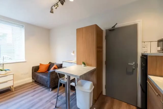 Sofa cabinet table trash can and desk living room at 29 Trewhitt Road in Newcastle Upon Tyne Student Accommodation