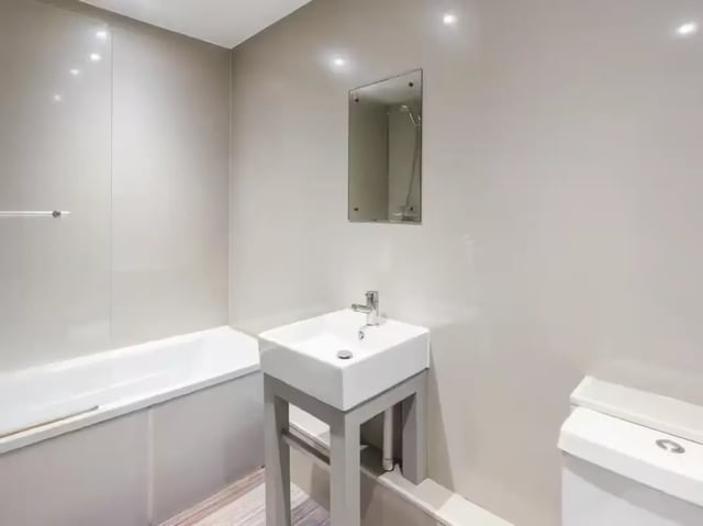 Bathtub sink mirror and toilet bathroom at 233 Leek Road in Stoke-On-Trent Student Accommodation