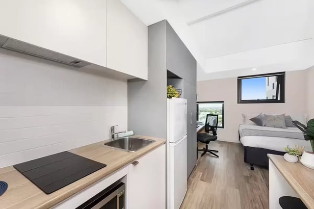 Kitchen sink induction hob microwave bed desk studio apartment at Scape Waymouth in Adelaide Student Accommodation