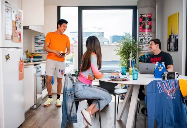 Students in kitchen area at table Image Type Kitchen at Scape Waymouth in Adelaide Student Accommodation