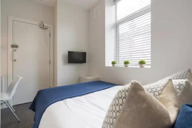 Bed TV white chair and window Bedroom at 125 Ashford Street in Stoke-On-Trent Student Accommodation