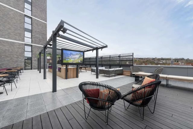 Modern rooftop terrace with seating lounge and television exterior at Hillside House Sheffield in Sheffield Student Accommodation