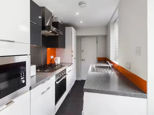 Modern kitchen with oven stove microwave sink kitchen at 41 Guildford Street in Stoke-On-Trent Student Accommodation