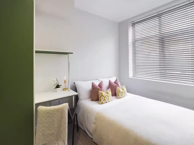 Bed desk chair and pillows bedroom at 41 Guildford Street in Stoke-On-Trent Student Accommodation