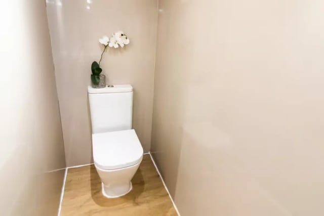 White toilet with orchid plant bathroom at 231 Leek Road in Stoke-On-Trent Student Accommodation