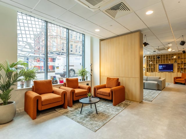 Orange armchairs with coffee table lounge area at Straits Manor in Sheffield Student Accommodation
