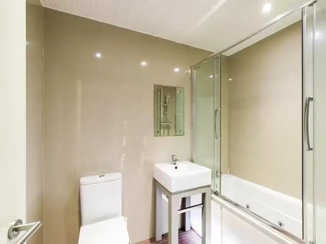 Toilet sink shower bath with glass enclosure bathroom at 2 Queen Anne Street in Stoke-On-Trent Student Accommodation