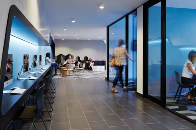 Modern study area with computers and lounge seating Study area at Scape Berkeley in Melbourne Student Accommodation