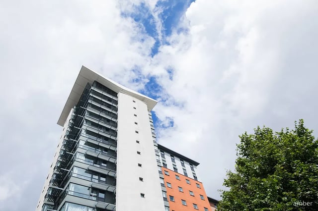 Modern apartment building with balconies and orange facade Exterior at Mercury Point in Southampton Student Accommodation