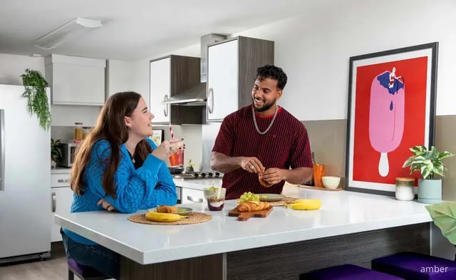 Two students eating breakfast in modern kitchen kitchen at Mercury Point in Southampton Student Accommodation