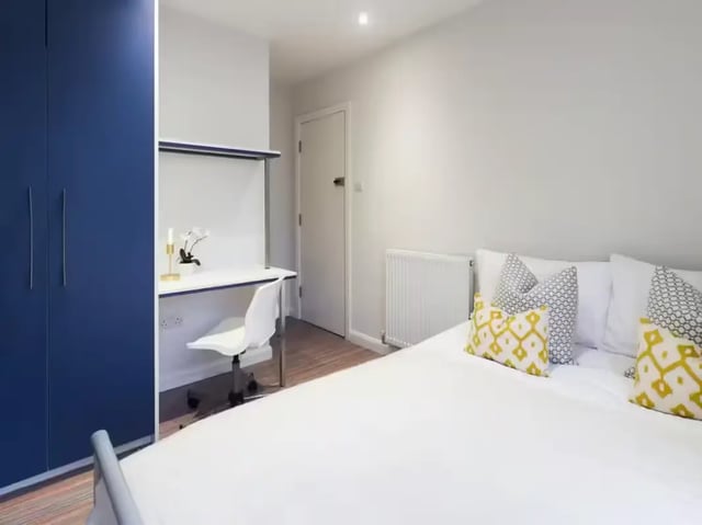 Blue wardrobe desk and bed bedroom at 6 Guildford Street in Stoke-On-Trent Student Accommodation