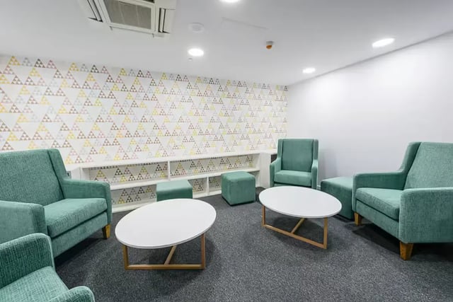 Seating ottomans white tables patterned wall lounge at Scape Regent in Brisbane Student Accommodation