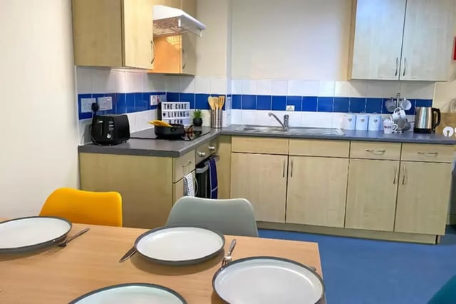 Kitchen with cabinets toaster sink and table kitchen at The Cube - Loughborough in Loughborough Student Accommodation