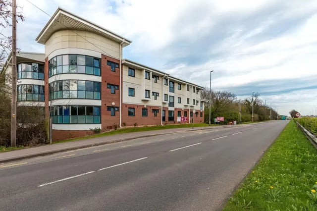 Modern building with curved windows and brick exterior exterior at The Cube - Loughborough in Loughborough Student Accommodation