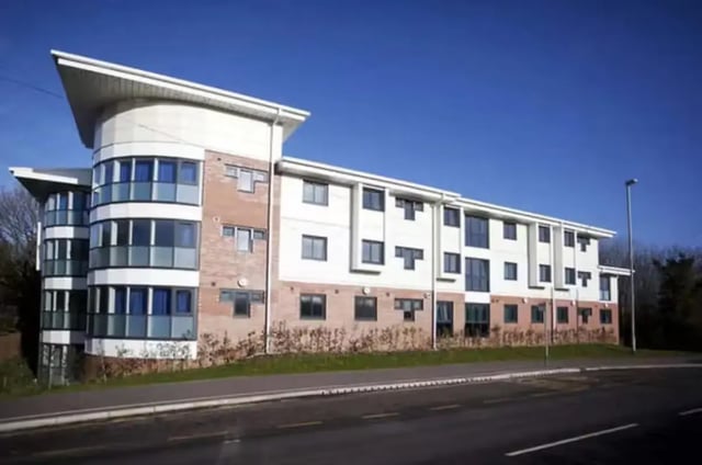 Modern building with curved glass windows exterior at The Cube - Loughborough in Loughborough Student Accommodation