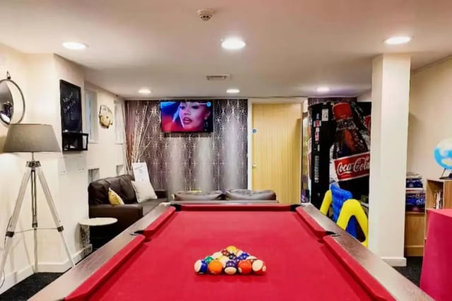 Pool table with balls and seating area Living room at The Cube - Loughborough in Loughborough Student Accommodation