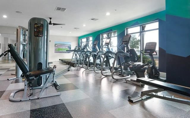Fitness machines including treadmills elliptical machines Image Type Gym at Greene Crossing Apartments in Columbia Student Accommodation