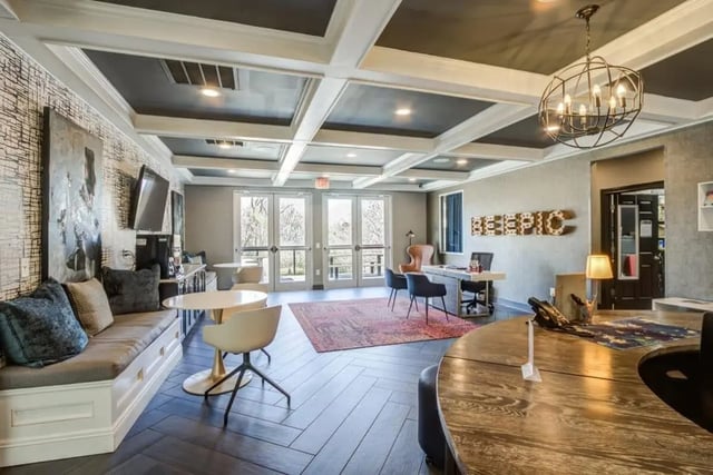 Lounge seating reception desk and tables communal area at Campus Edge Apartments in Raleigh Student Accommodation