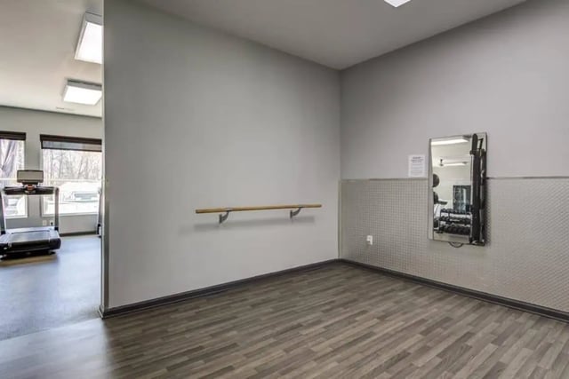 Treadmill barre and weights fitness area at Campus Edge Apartments in Raleigh Student Accommodation