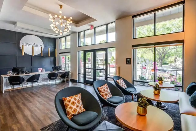 Lobby with chairs and reception desk Living room at Signature 1505 (Theory) in Raleigh Student Accommodation