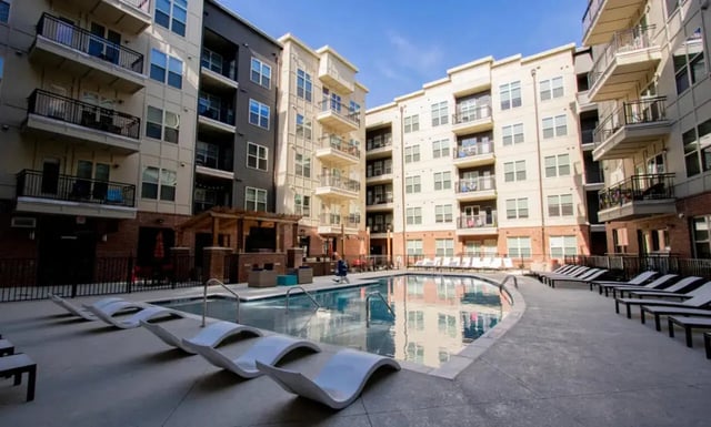 Apartment buildings with pool and lounge chairs exterior at Signature 1505 (Theory) in Raleigh Student Accommodation